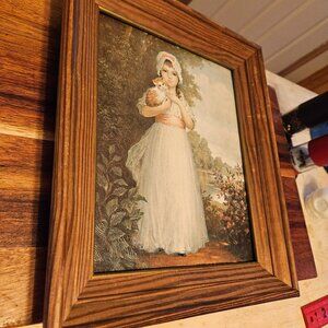 vintage framed art young girl holding a kitten signed 69 on back